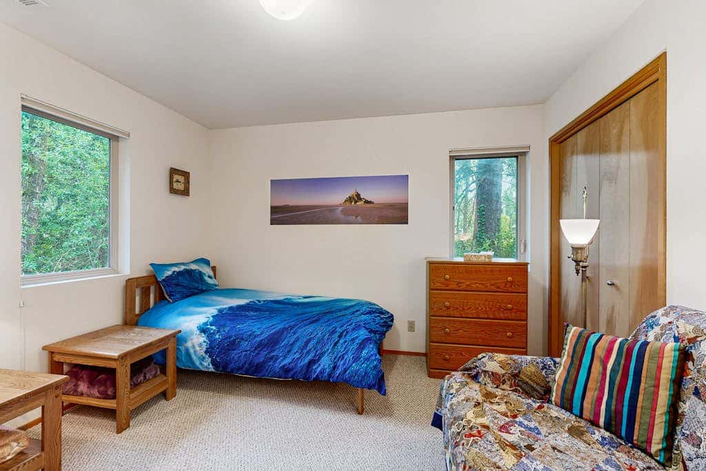 Forest-view home with fireplace, deck - Walk to the Beach & Golf Course