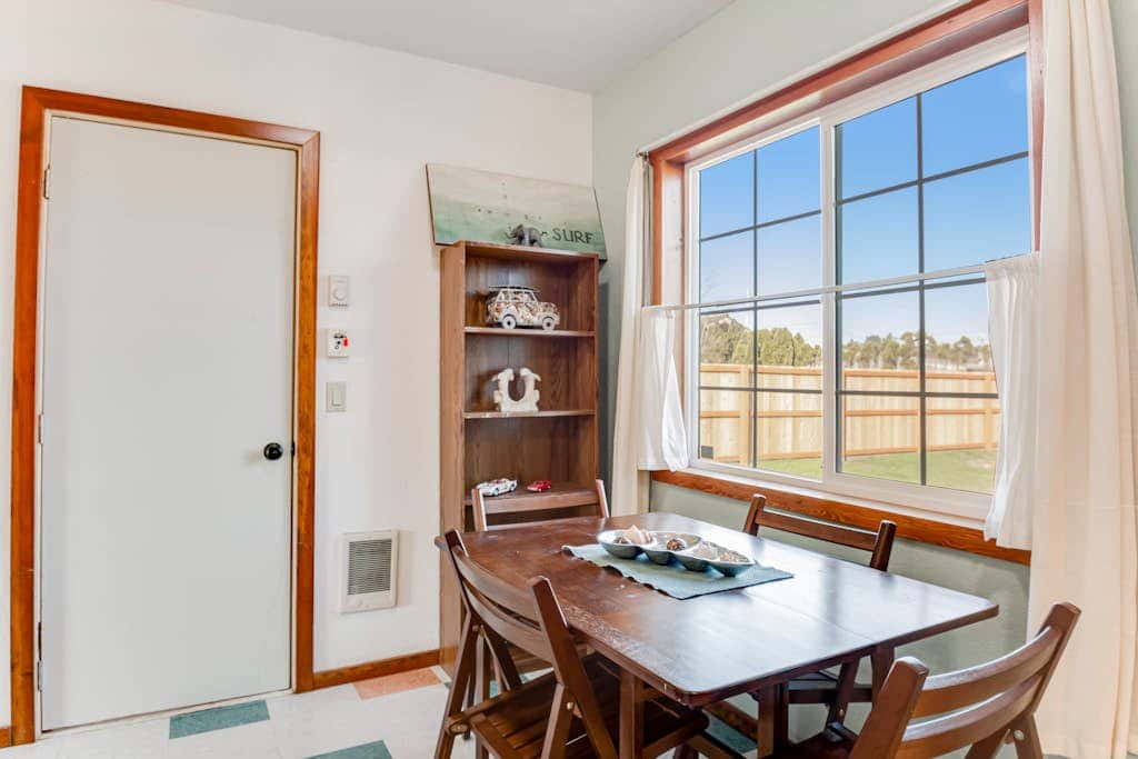 Downtown home with private hot tub & WiFi - walk to beach - dog-friendly yard