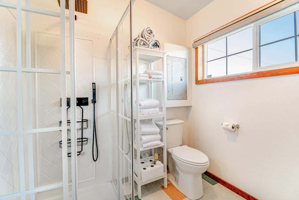 Downtown home with private hot tub & WiFi - walk to beach - dog-friendly yard