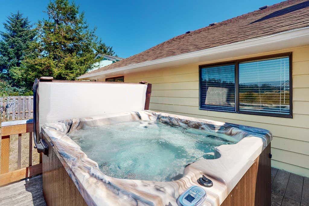 Dog-friendly house on Alsea Bay with bridge views, grill & private hot tub