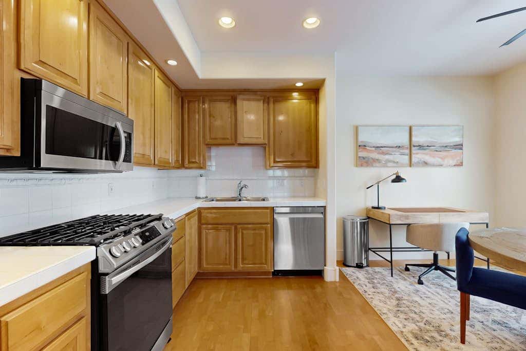 Conveniently located townhome with kitchen, kitchenette, balcony & fireplace