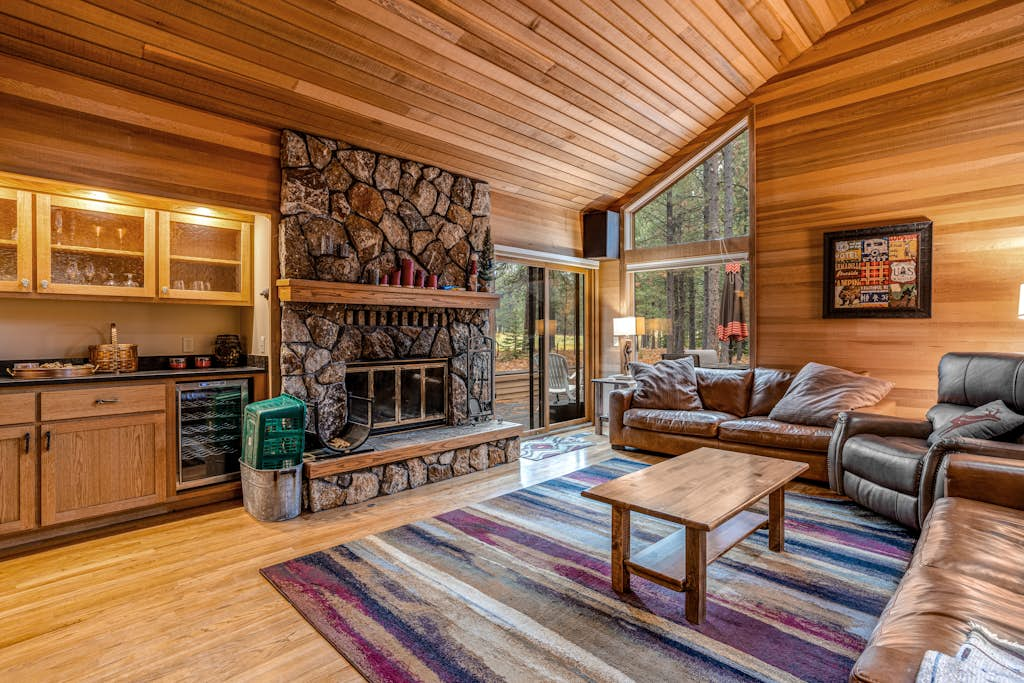 Forested getaway with kitchen, stone fireplace, pool, & private hot tub
