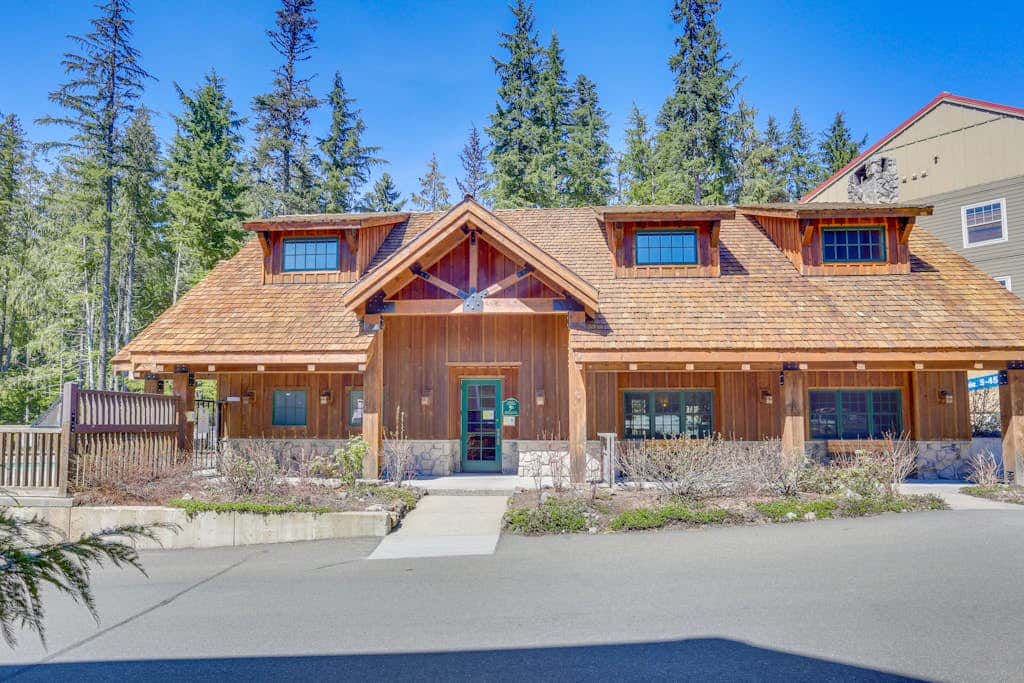 Three-story retreat with a gas fireplace plus access to pool, hot tub, & sauna