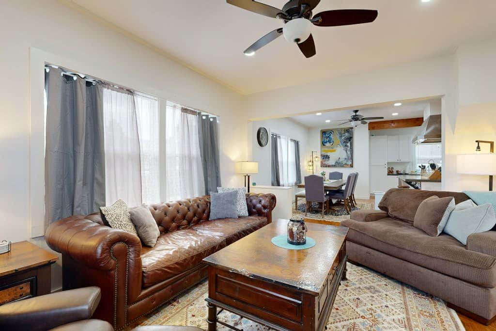 Relaxing river-view home with private patio, grill, covered balcony, & W&D