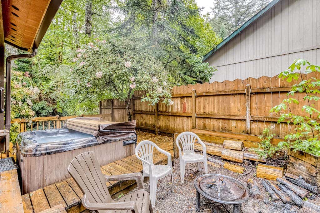 Expansive Wooded Home with a Brook, Firepit, Private Hot Tub and Shared Pool