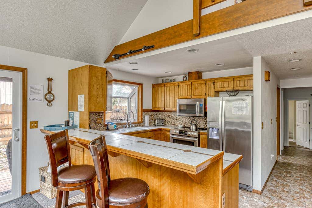 Expansive Wooded Home with a Brook, Firepit, Private Hot Tub and Shared Pool