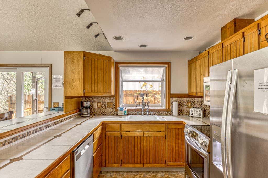 Expansive Wooded Home with a Brook, Firepit, Private Hot Tub and Shared Pool