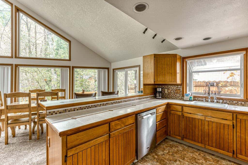 Expansive Wooded Home with a Brook, Firepit, Private Hot Tub and Shared Pool