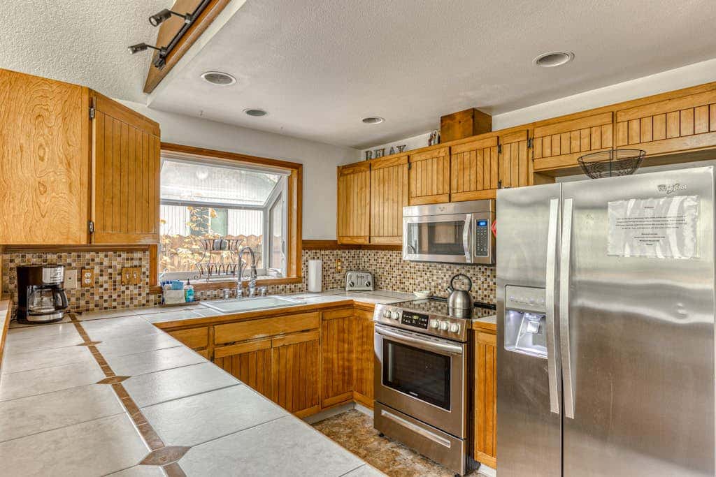 Expansive Wooded Home with a Brook, Firepit, Private Hot Tub and Shared Pool