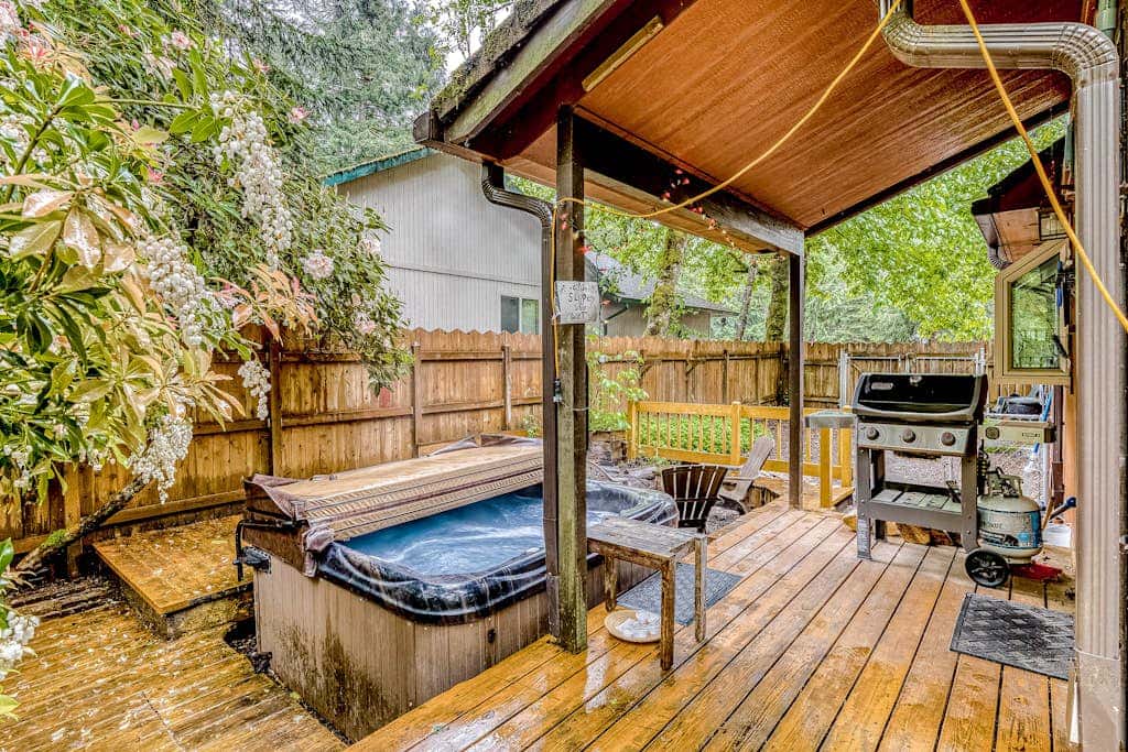 Expansive Wooded Home with a Brook, Firepit, Private Hot Tub and Shared Pool