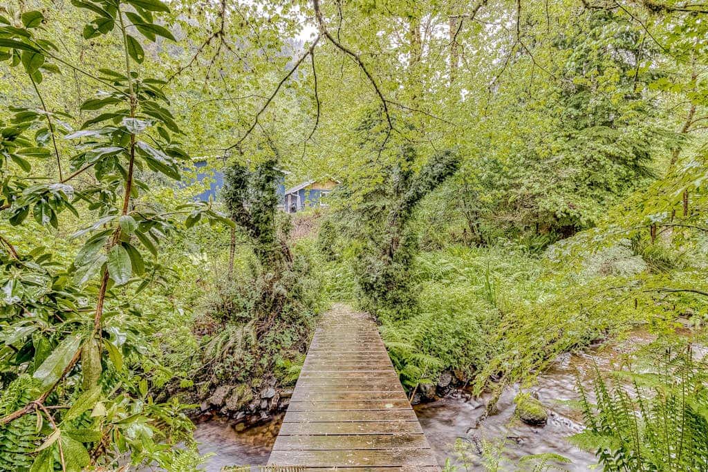 Expansive Wooded Home with a Brook, Firepit, Private Hot Tub and Shared Pool