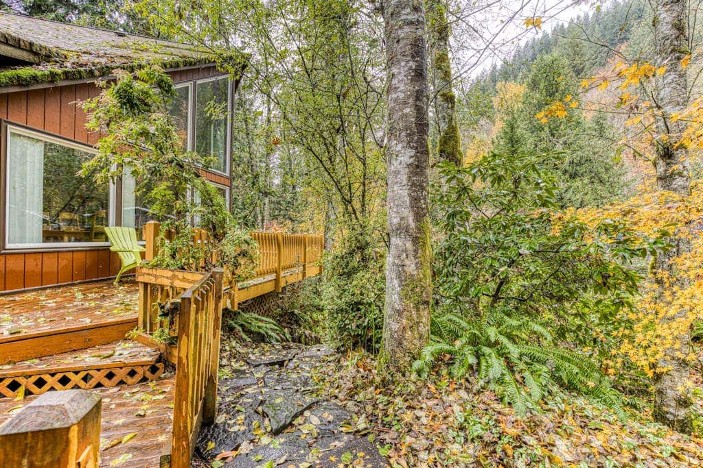 Expansive Wooded Home with a Brook, Firepit, Private Hot Tub and Shared Pool