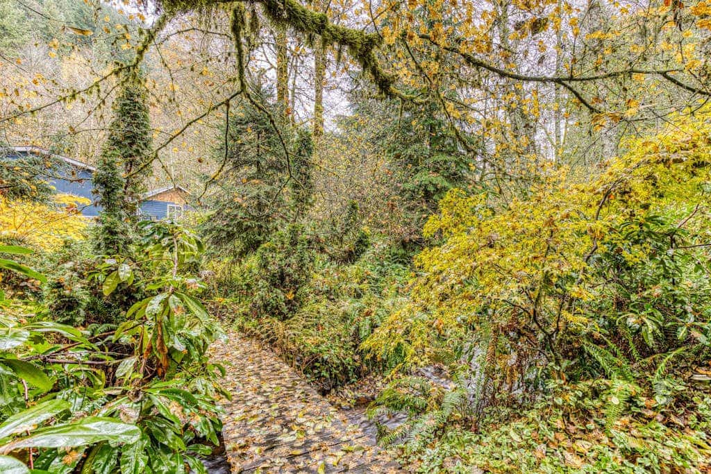 Expansive Wooded Home with a Brook, Firepit, Private Hot Tub and Shared Pool