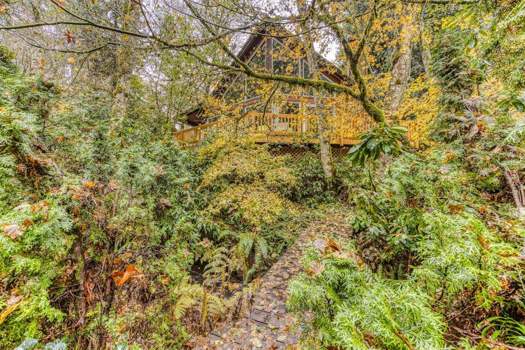 Expansive Wooded Home with a Brook, Firepit, Private Hot Tub and Shared Pool