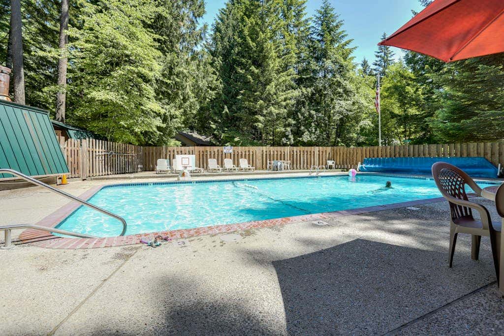 Expansive Wooded Home with a Brook, Firepit, Private Hot Tub and Shared Pool
