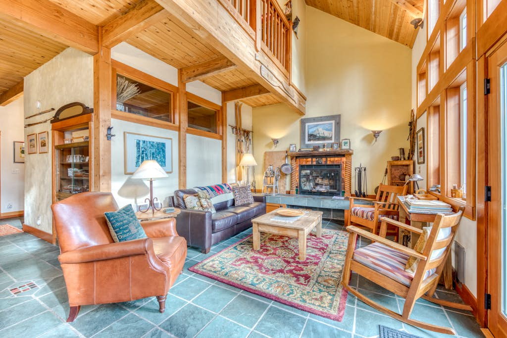 Riverfront home close to skiing & fishing with beach access & huge VHS library