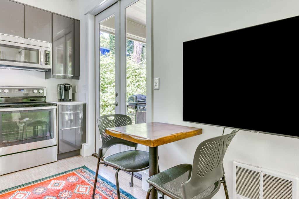 Dog-friendly studio with river view, patio, grill, & shared W&D