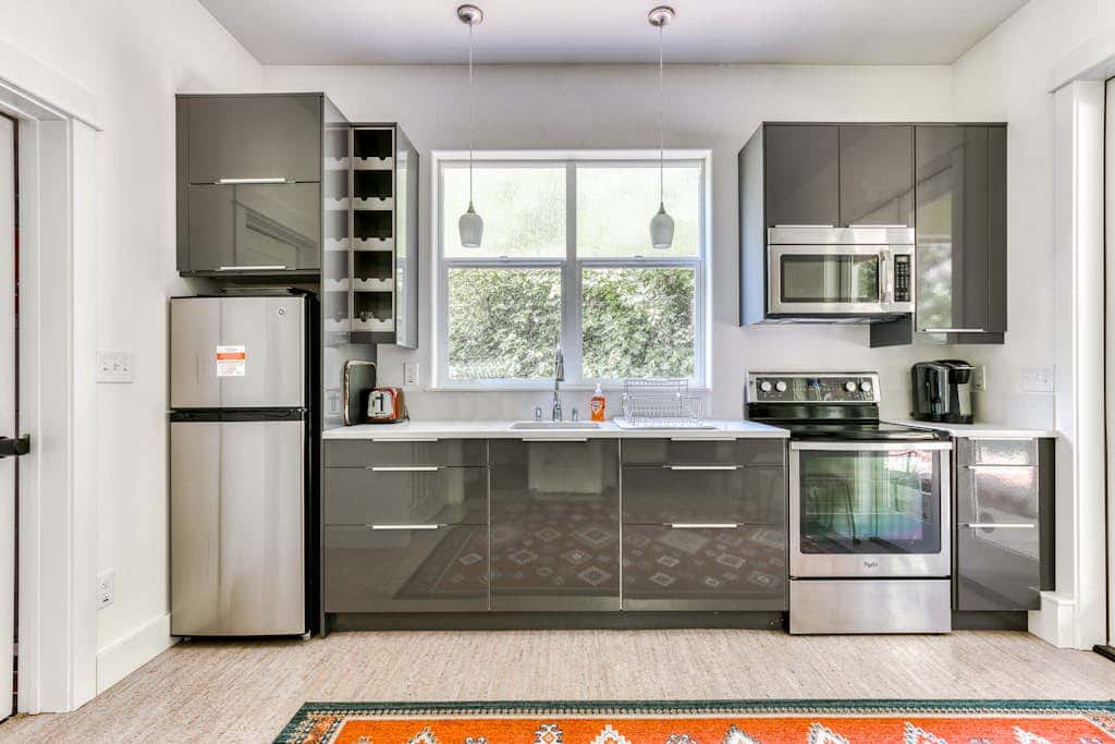 Dog-friendly studio with river view, patio, grill, & shared W&D
