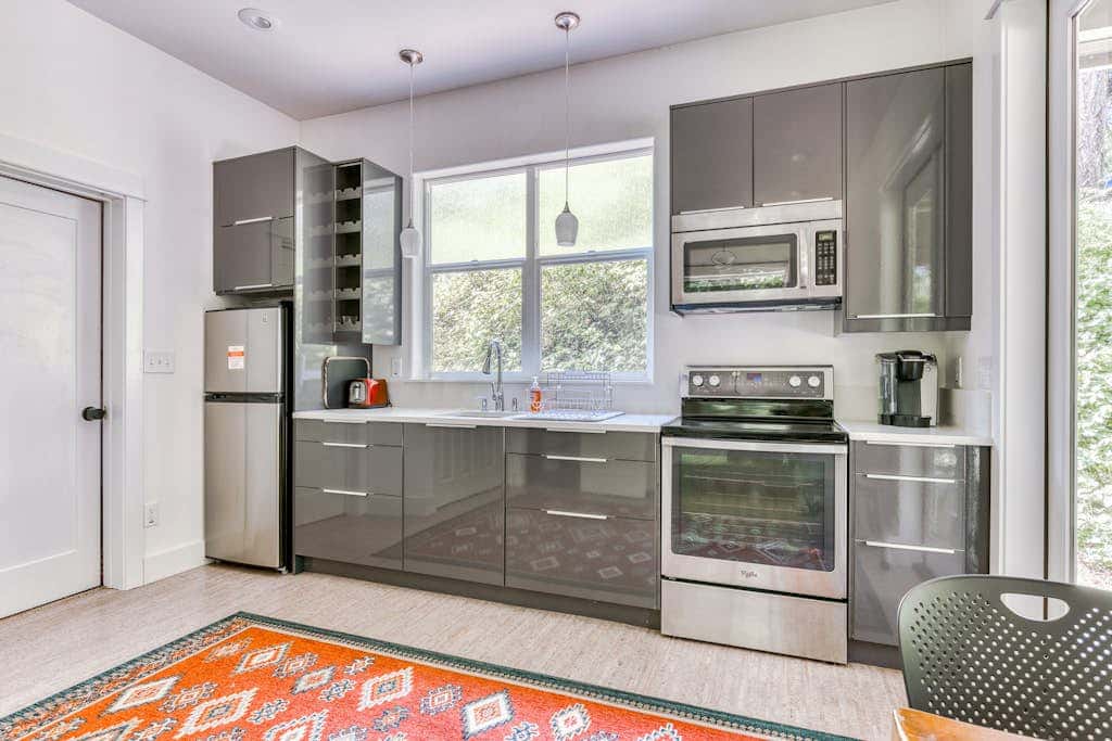 Dog-friendly studio with river view, patio, grill, & shared W&D