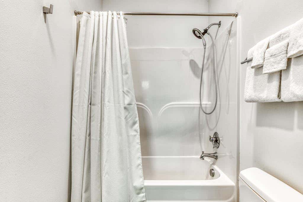 Dog-friendly studio with river view, patio, grill, & shared W&D