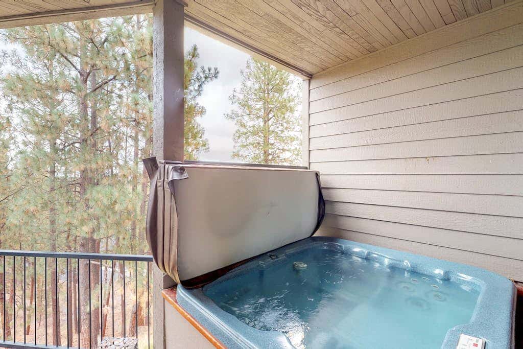 Comfortable condo with private hot tub & great location