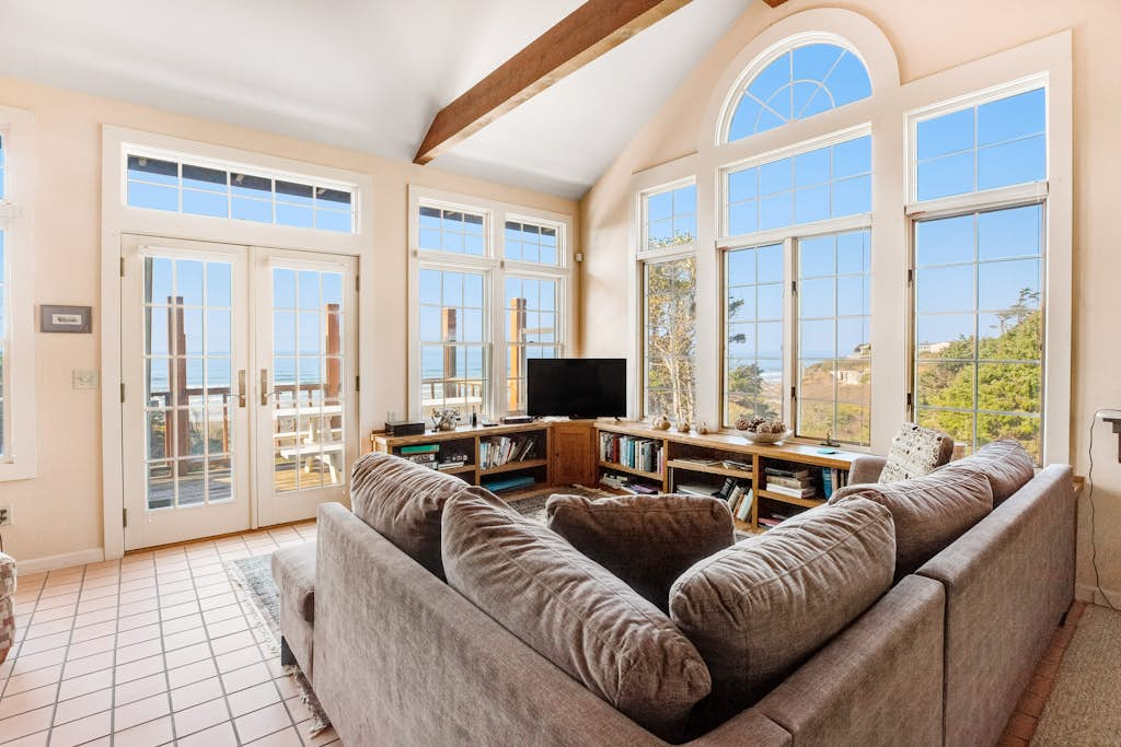 Secluded beachfront home with Pacific Ocean views, fireplace, game room, grill
