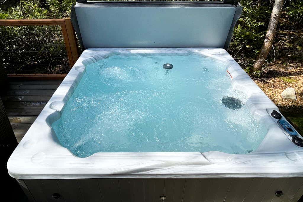 Brand-new home with hot tub, deck, fast WiFi, central AC, & great location