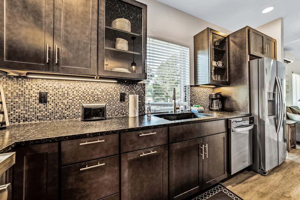 Sunny apt with fireplace, partial water views, washer/dryer, grill & AC