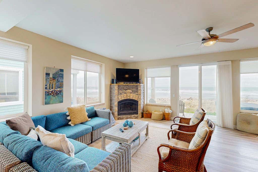 Modern oceanfront home with private hot tub, patio, & gas fireplace