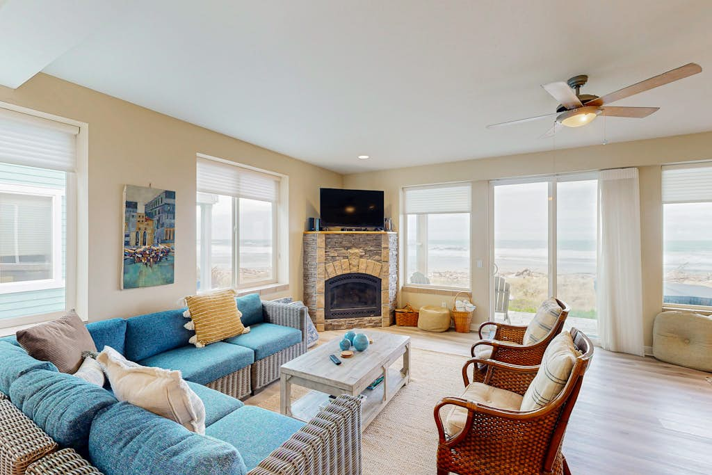 Modern oceanfront home with private hot tub, patio, & gas fireplace
