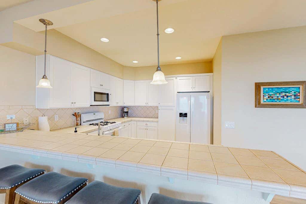 Modern oceanfront home with private hot tub, patio, & gas fireplace