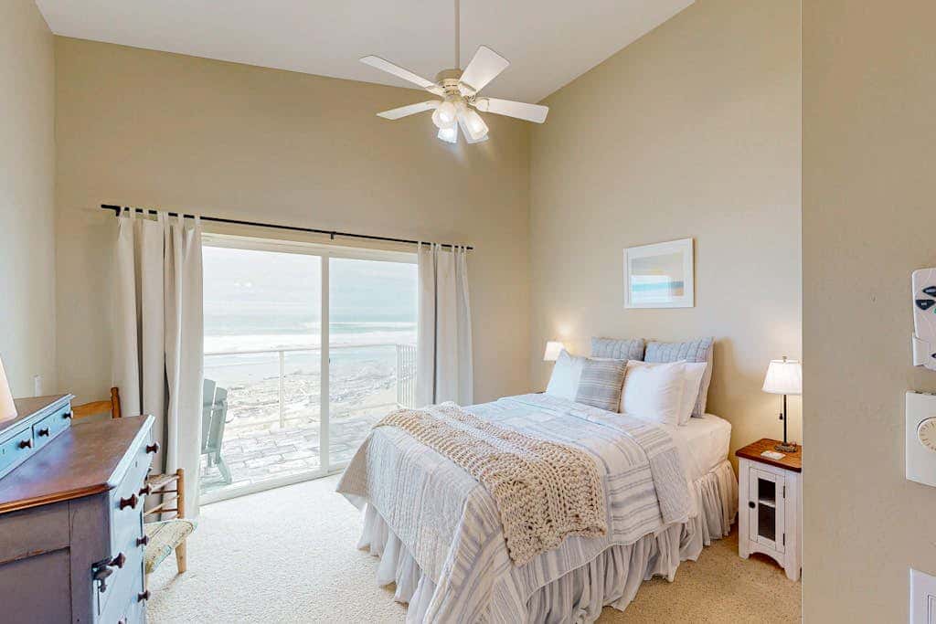 Modern oceanfront home with private hot tub, patio, & gas fireplace