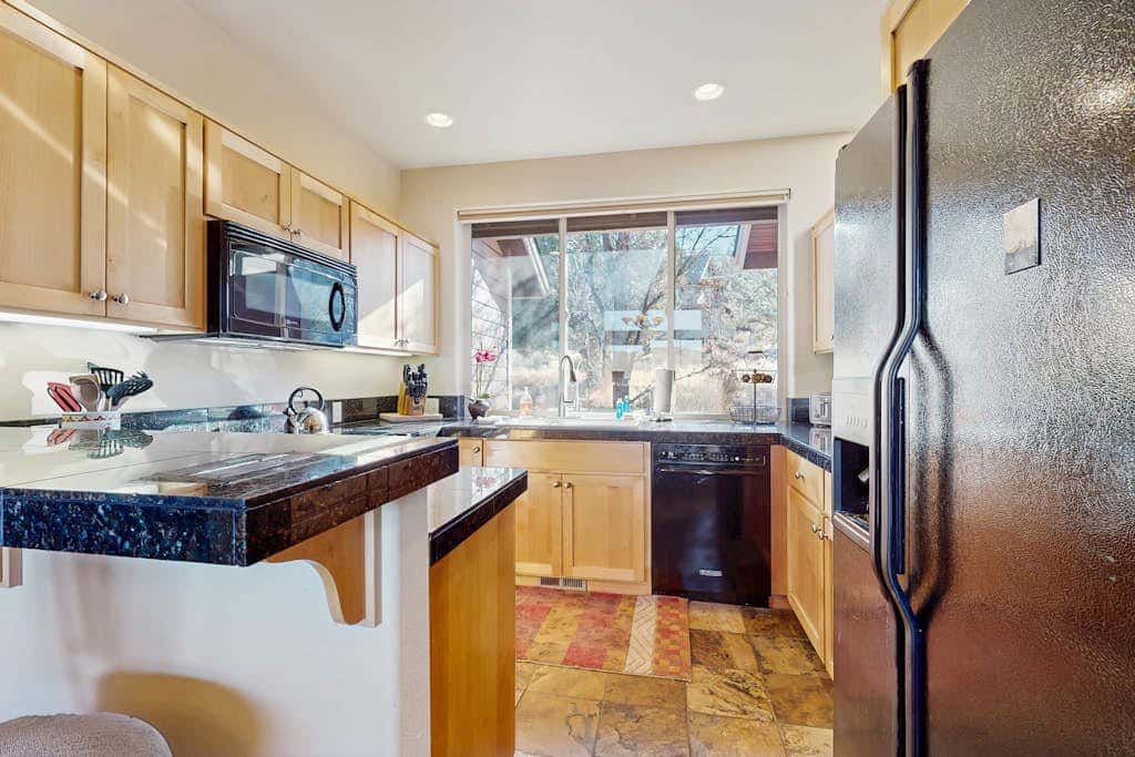 Dog-friendly townhome with mountain views, pools, hot tubs, fitness room, & W&D