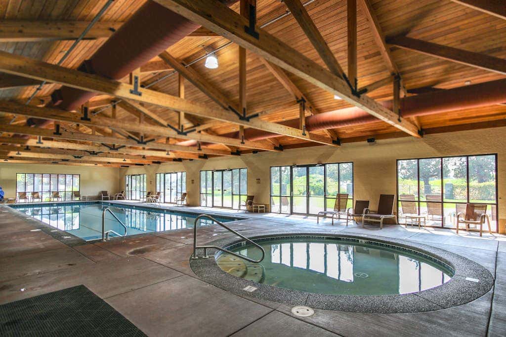 Dog-friendly townhome with mountain views, pools, hot tubs, fitness room, & W&D