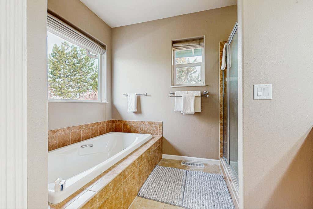 Cozy home with gas fireplace, private hot tub, & gas grill - in great neighborhood