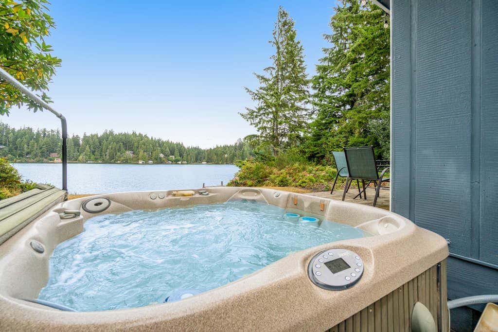 Waterfront retreat with lake views & private hot tub