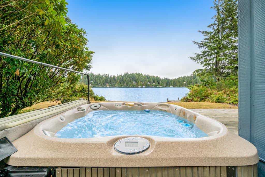 Waterfront retreat with lake views & private hot tub