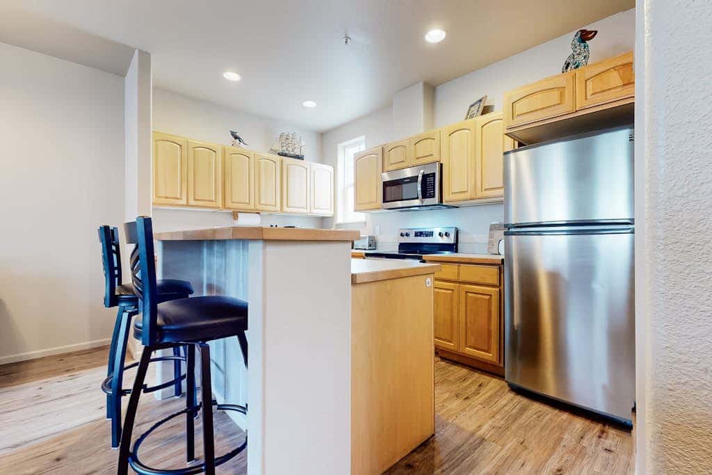 Dog-friendly condo with river views, private W&D, full kitchen, & great location