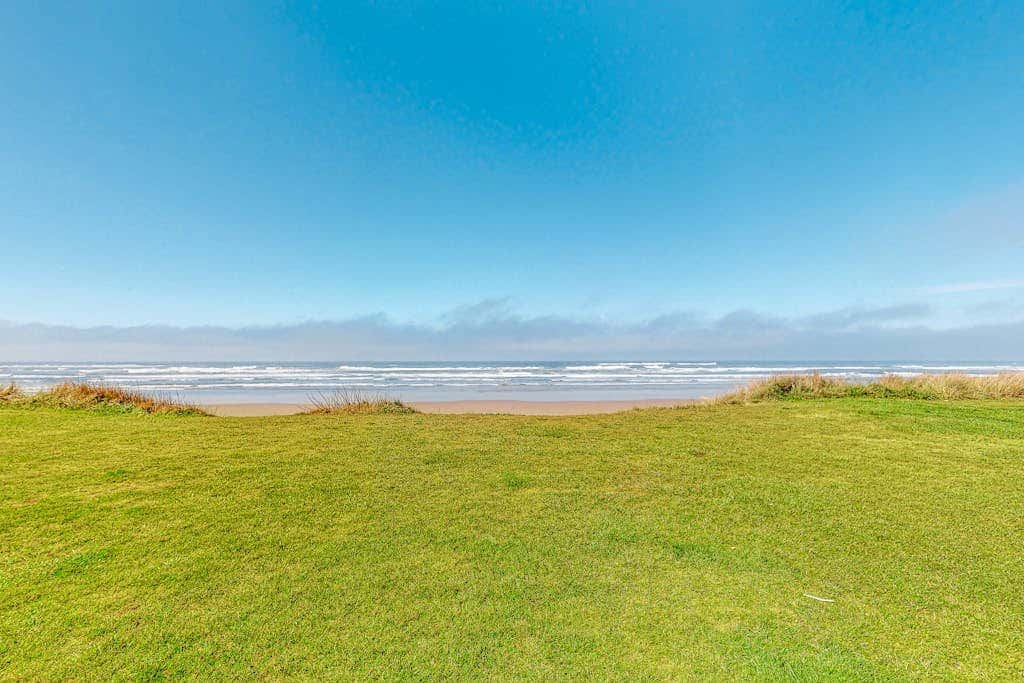 Dog-friendly oceanfront beach home with private hot tub and stunning ocean views