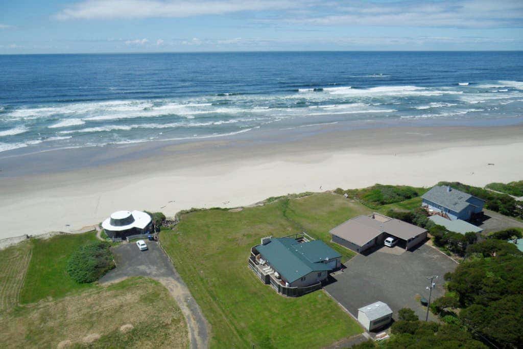 Dog-friendly oceanfront beach home with private hot tub and stunning ocean views