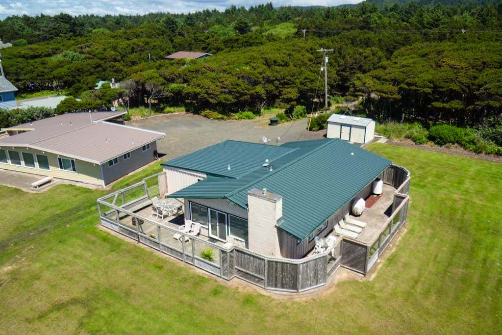 Dog-friendly oceanfront beach home with private hot tub and stunning ocean views