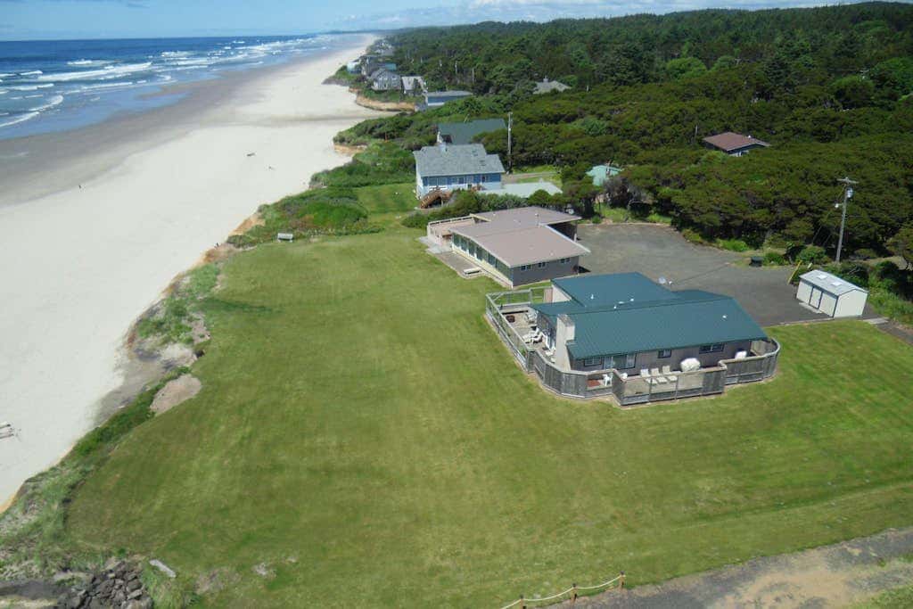 Dog-friendly oceanfront beach home with private hot tub and stunning ocean views