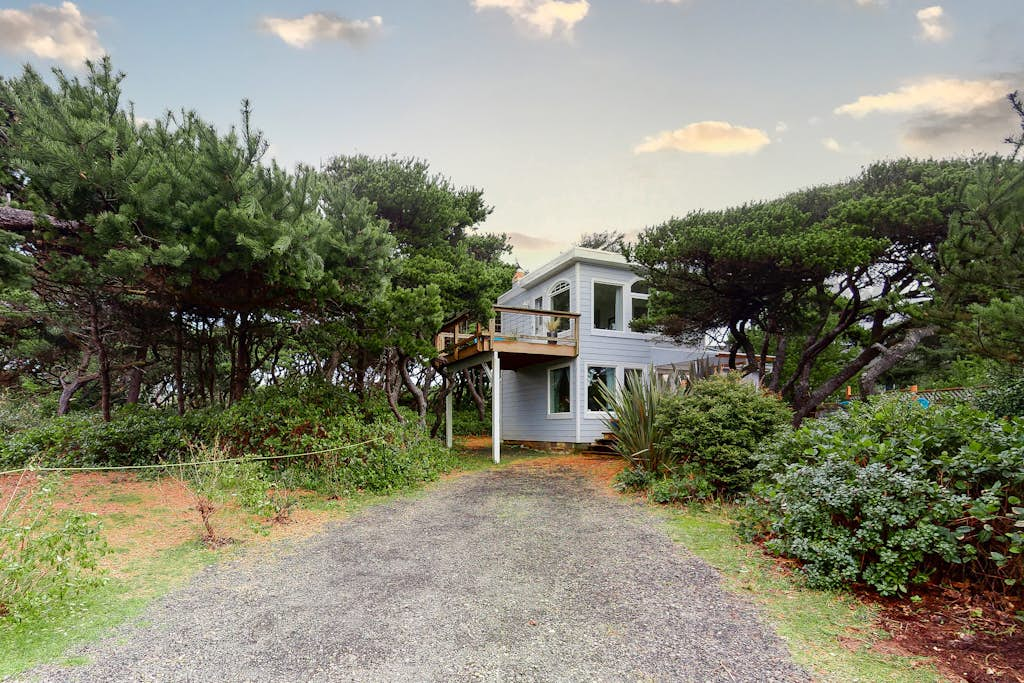 Dog-Friendly Getaway with Outdoor Firepit & Balcony - Steps from Beach Access
