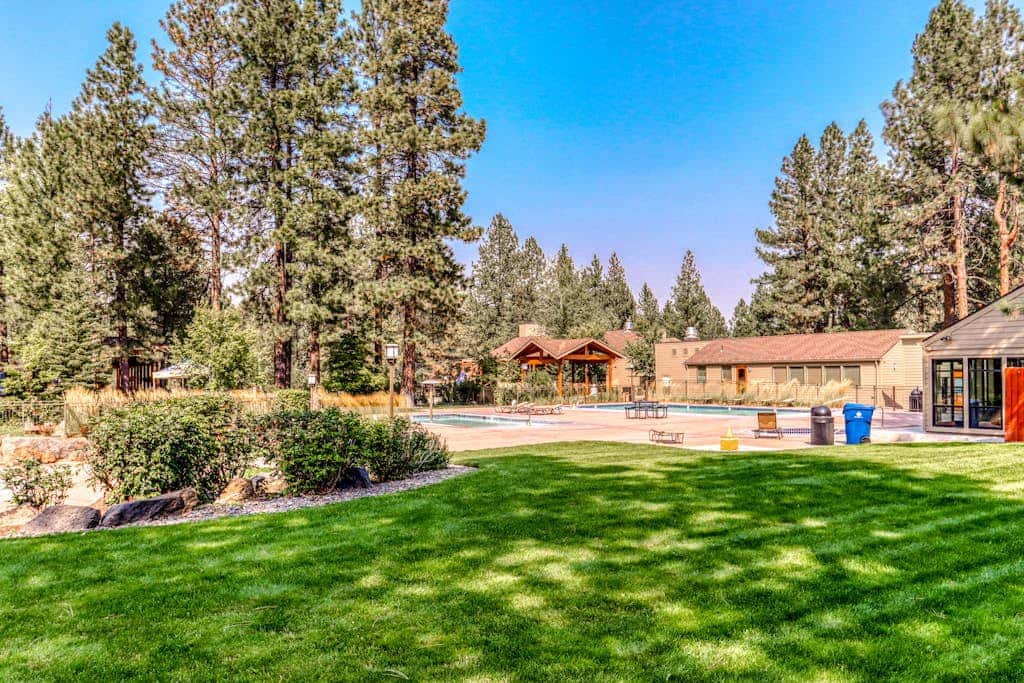 Third-floor retreat with treetop views, AC, pools, hot tubs, & sports courts