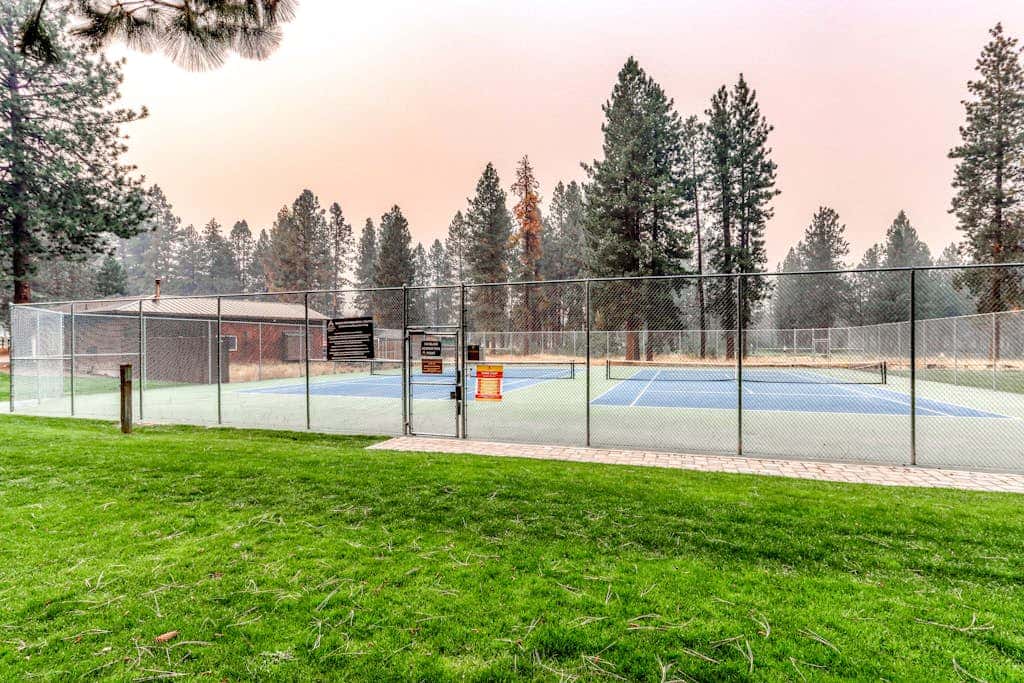 Third-floor retreat with treetop views, AC, pools, hot tubs, & sports courts