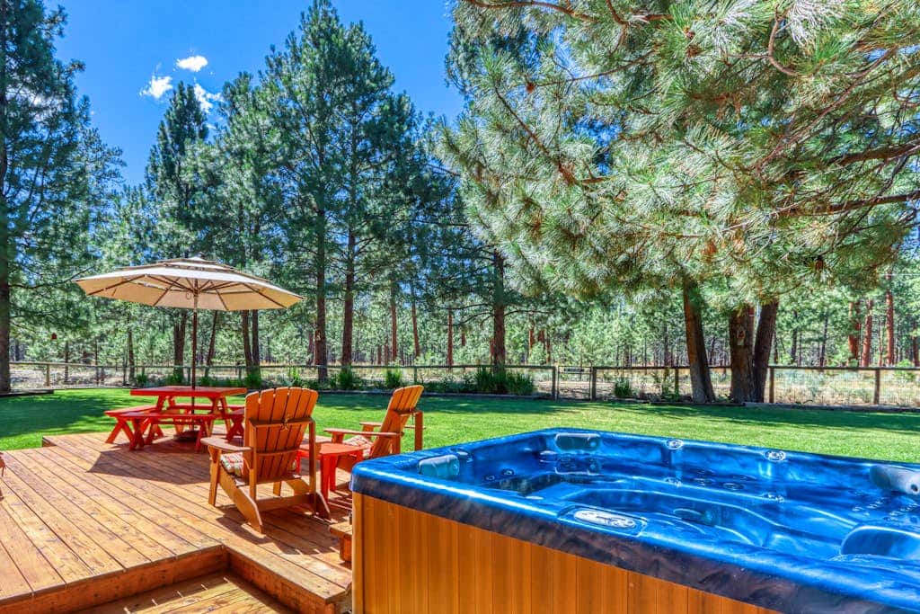 Home with a private hot tub, shared pool, & National Forest at your backdoor