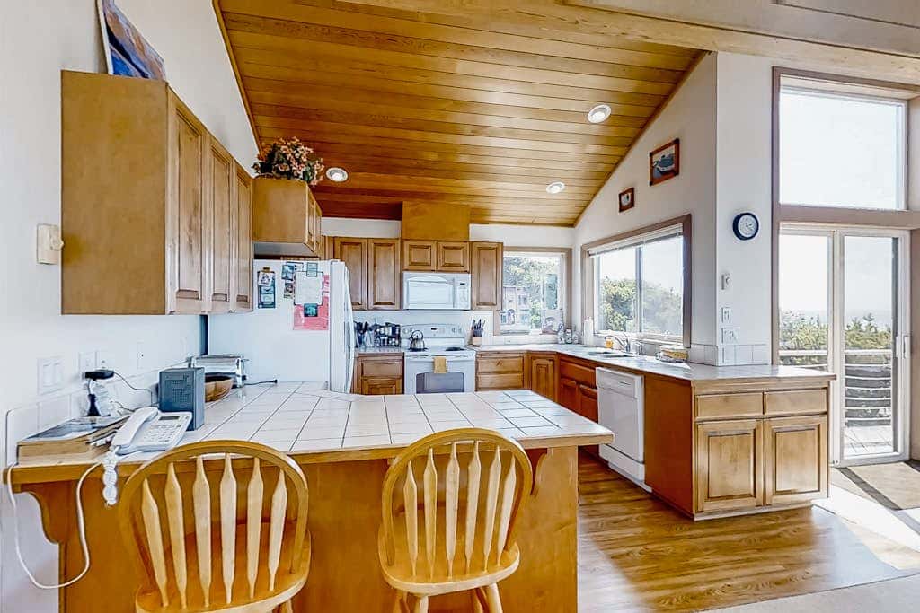 Spacious oceanfront home with free WiFi, and wrap-around deck