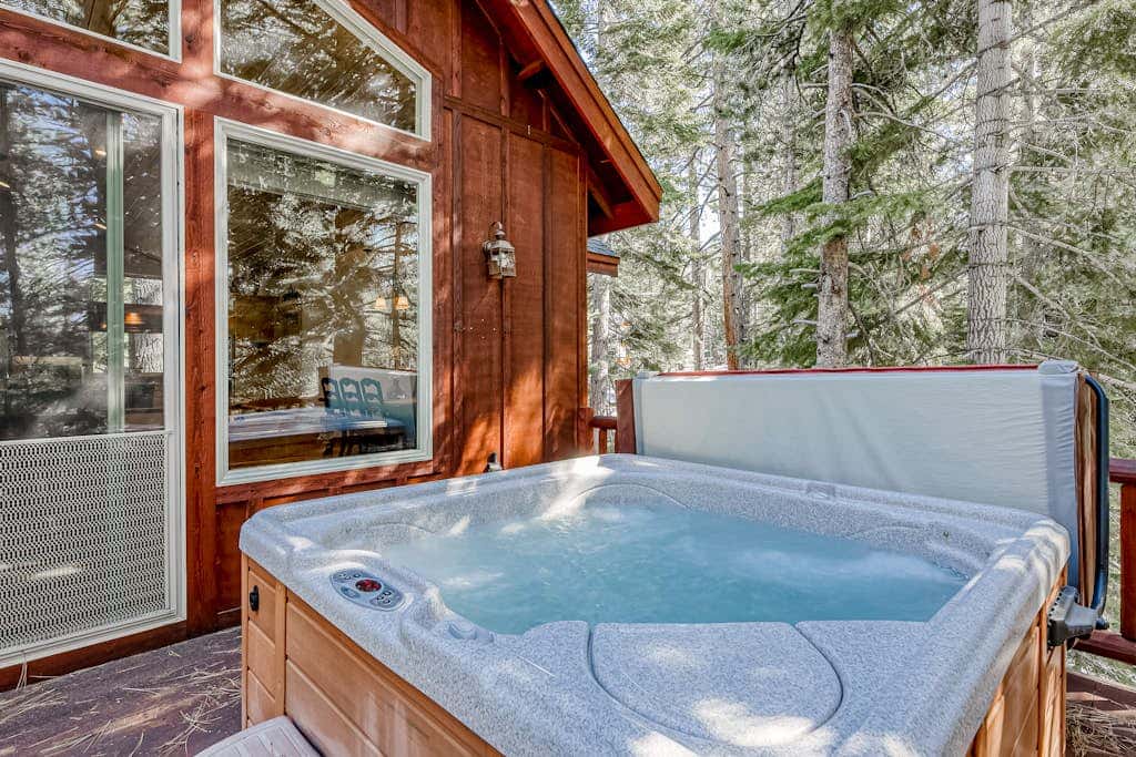 Inviting spacious home with fireplace, deck, hot tub, full kitchen, & W&D