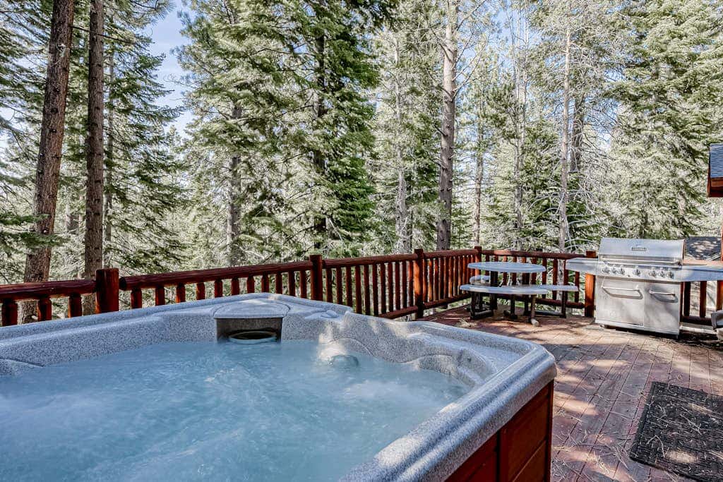 Inviting spacious home with fireplace, deck, hot tub, full kitchen, & W&D