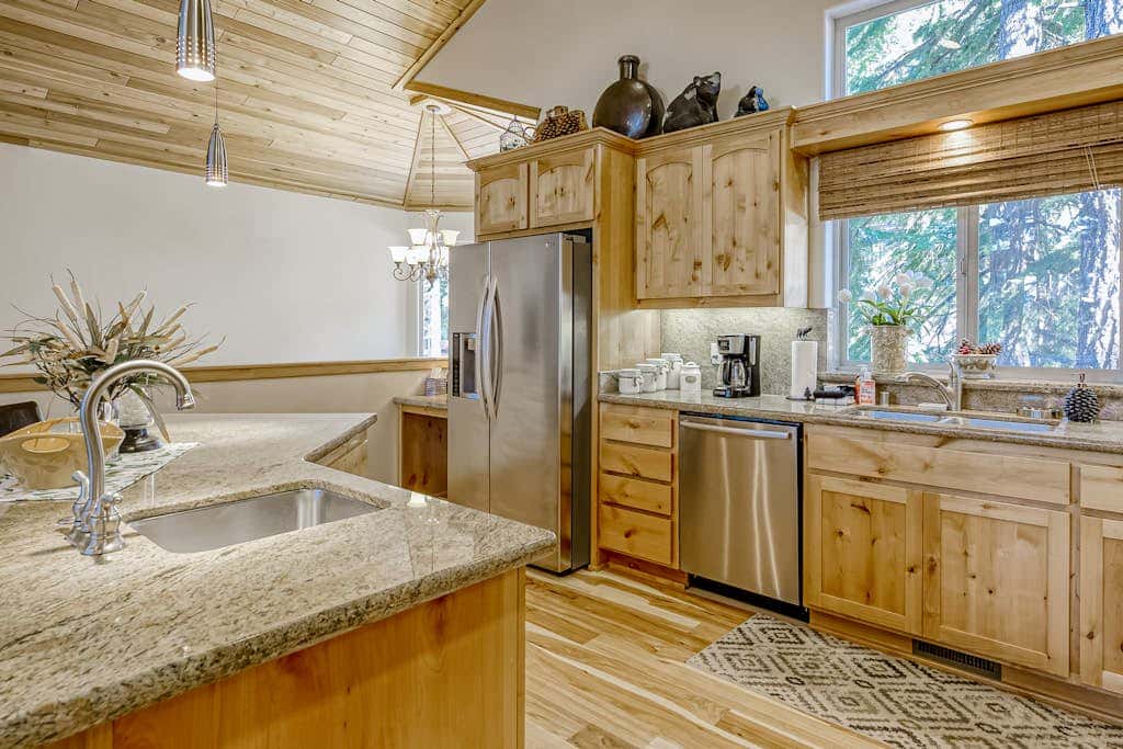 Inviting spacious home with fireplace, deck, hot tub, full kitchen, & W&D